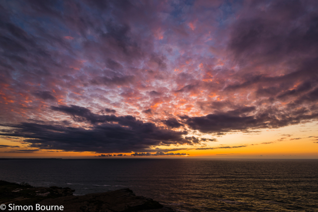 Simon Bourne, photography, photographer, Tintagel, Cornwall, portfolio, image, spring, early evening, dusk, sunset, Glebe Cliff, sea, red skies, orange sky, cliffs